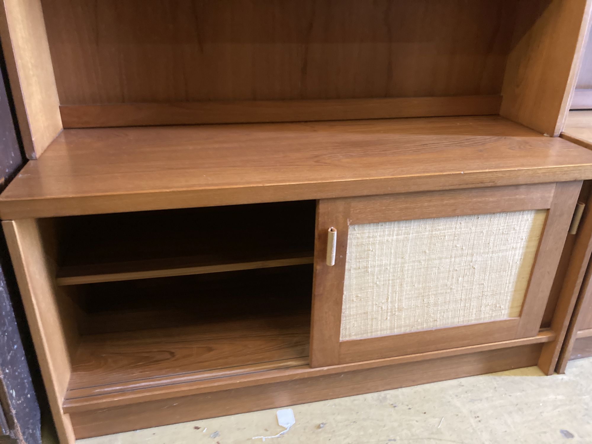 Three near-matching teak side cabinets,